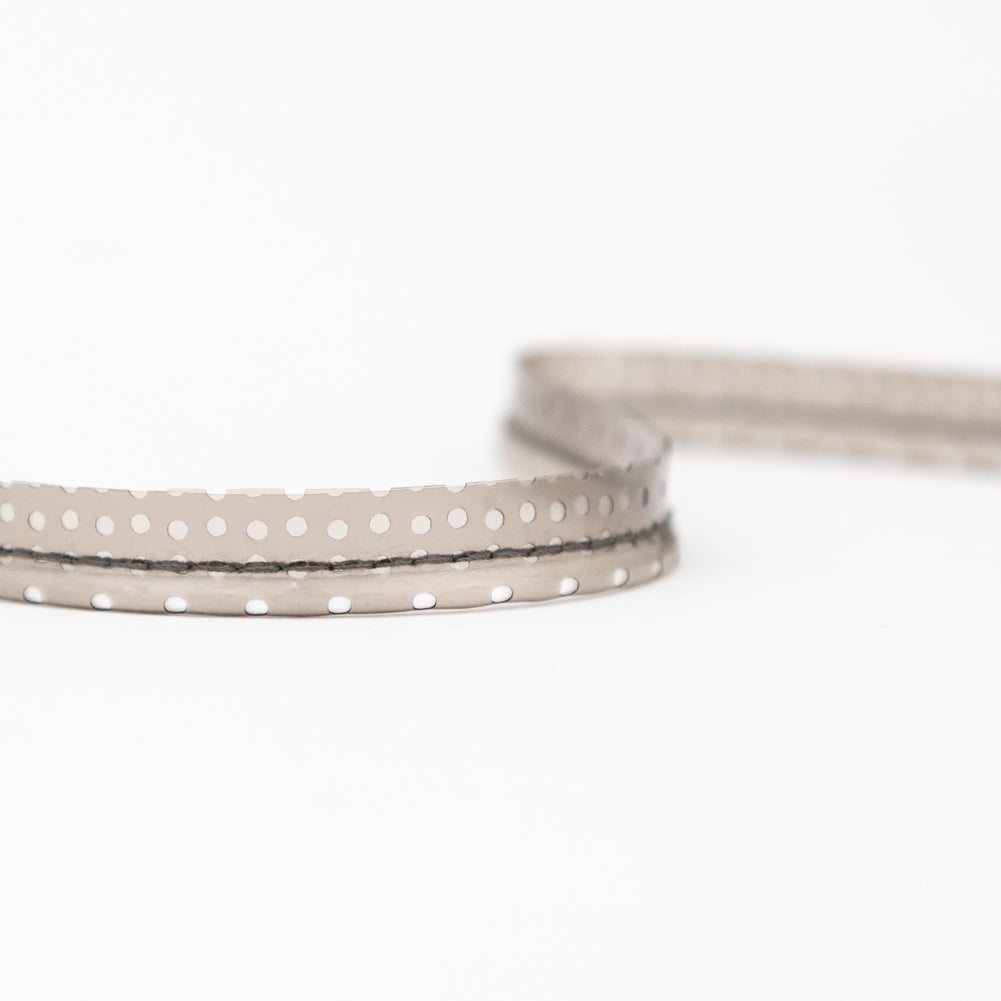 Italian White Rattail Piping with Black Perforated Plastic Casing and Lip - 0.375