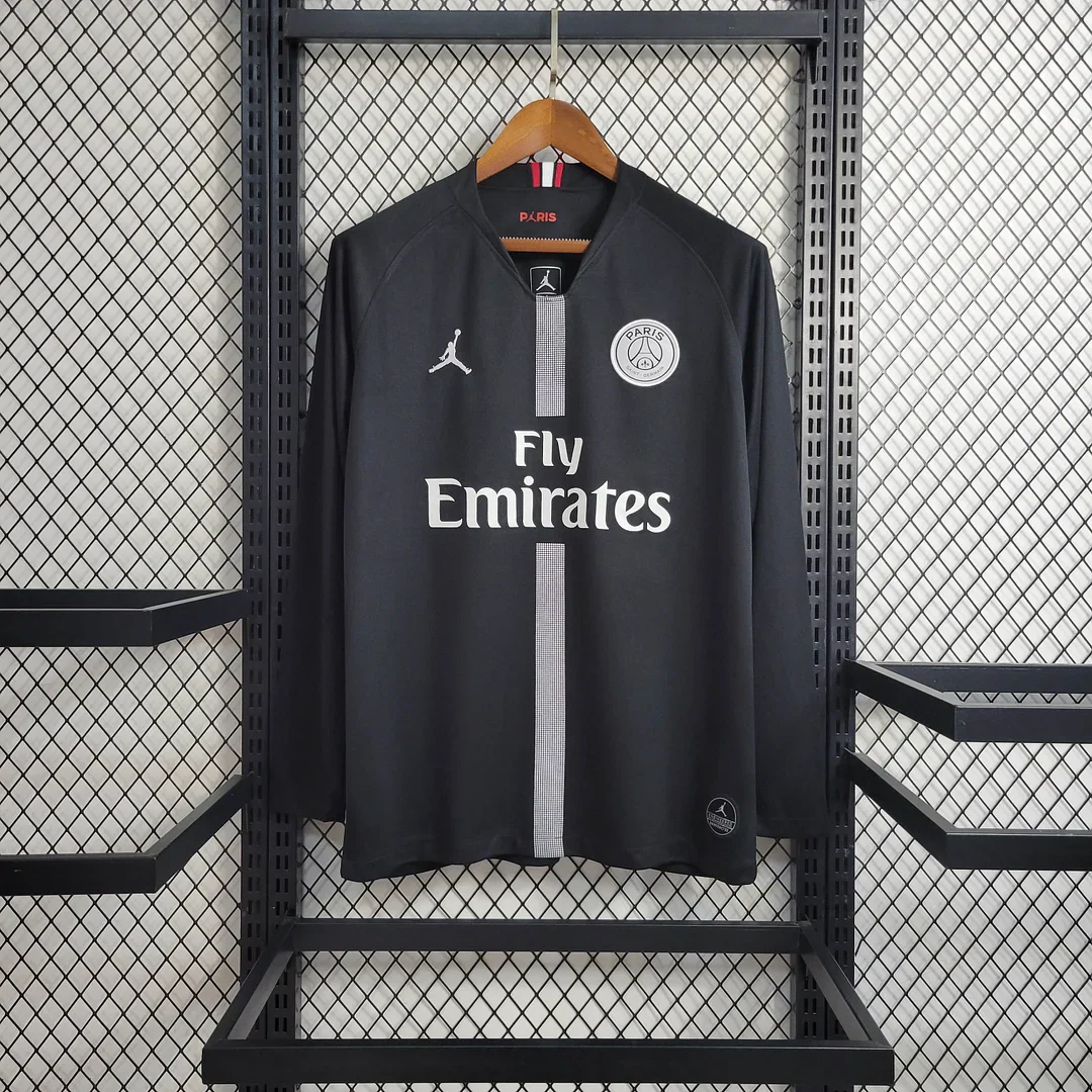 Black PSG European-style long-sleeve shirt with pale centre stripe and white Fly Emirates lettering