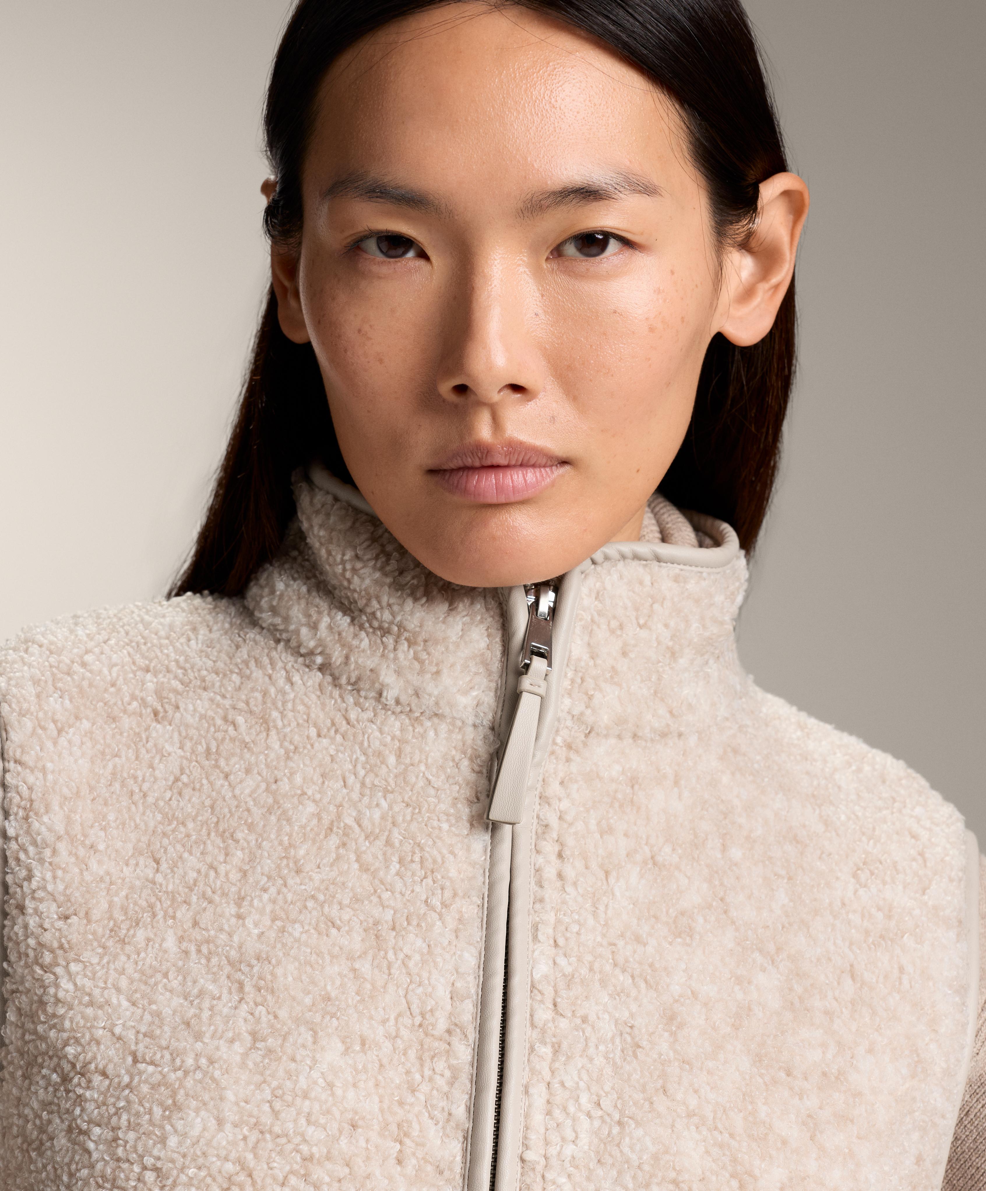Basic faux-shearling zip-up gilet.
