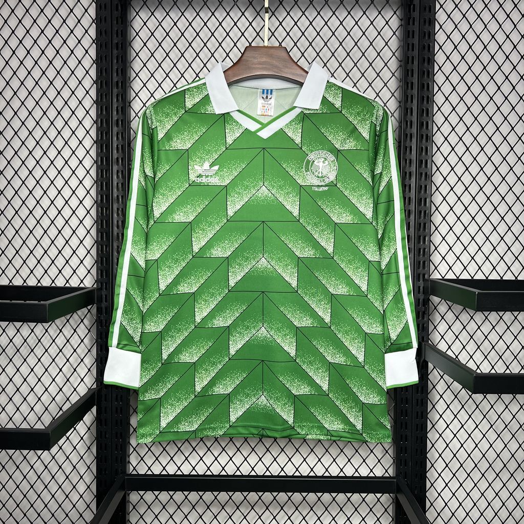 Green 1990 Germany away long-sleeve listing with geometric shapes, white fold collar and white cuffs