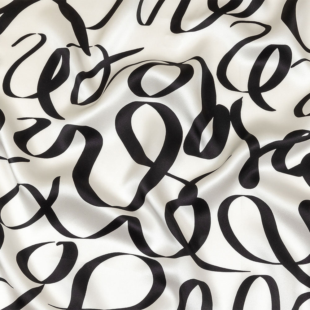 Mood Exclusive Italian Blanc de Blanc and Caviar Calligraphic Squiggles Silk Charmeuse - Joann Fabrics
