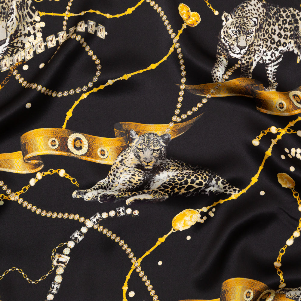 Mood Exclusive Italian Black and Gold Cheetahs and Gems Silk Charmeuse - Joann Fabrics