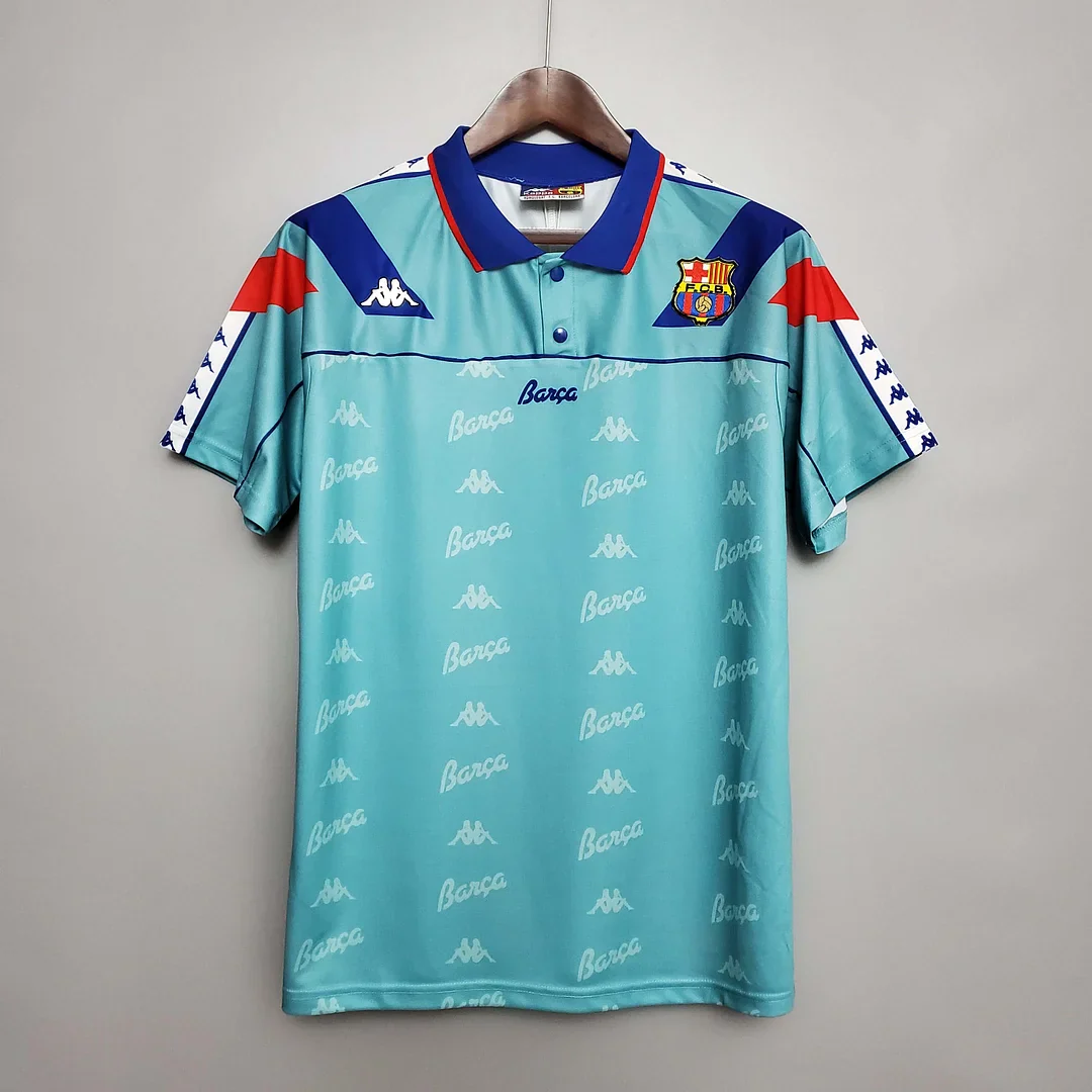 1992–95-labelled Barcelona away shirt with turquoise body, white script and blue and red shoulder shapes