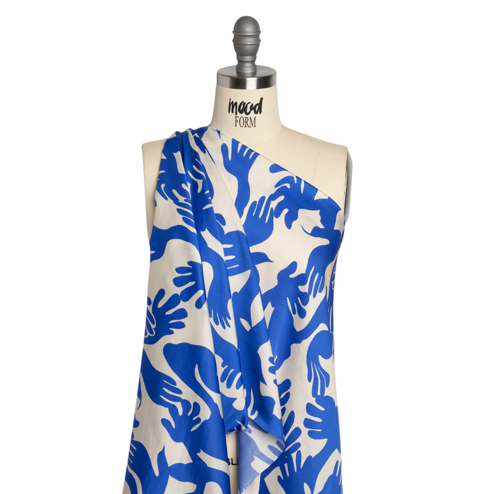 Sustainable and Recycled Viscose Satin Print - Blue and White Hands - Mood Exclusive Helping Hands - Joann Fabrics