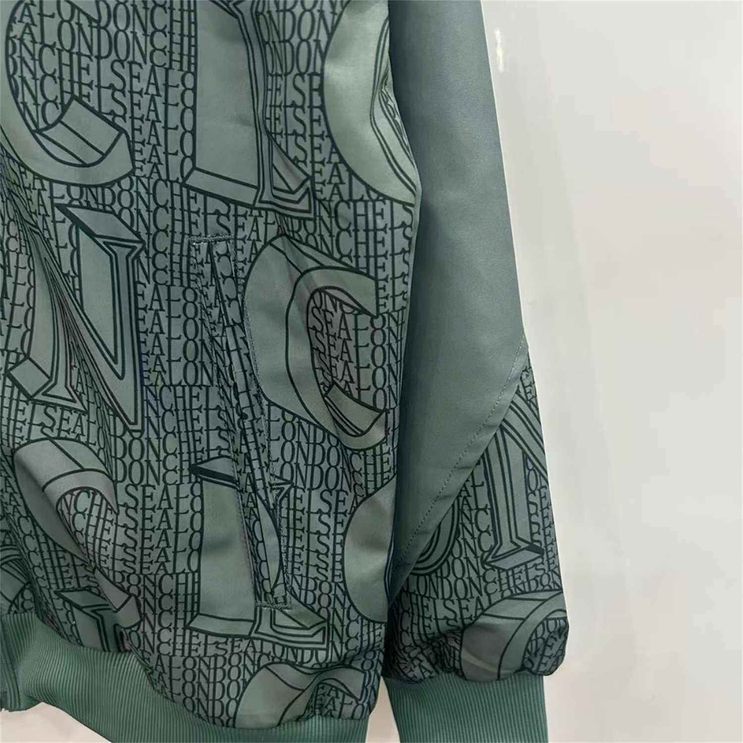 C.H.E.L.S.E.A 25-26 Subtle Letter Pattern Windbreaker Jacket - Dark Green - UnitedFutballJersey