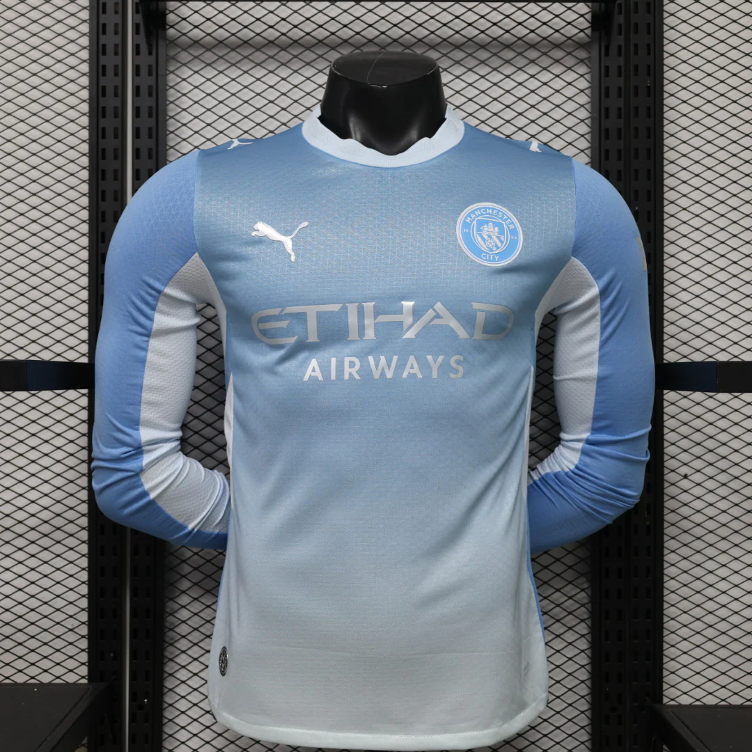 THJORE Manchester City long-sleeve home shirt showing blue outer sleeves and pale inner-arm panels