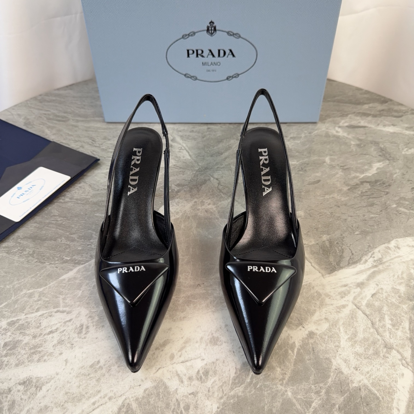 Prada women's black patent leather triangle logo high heels