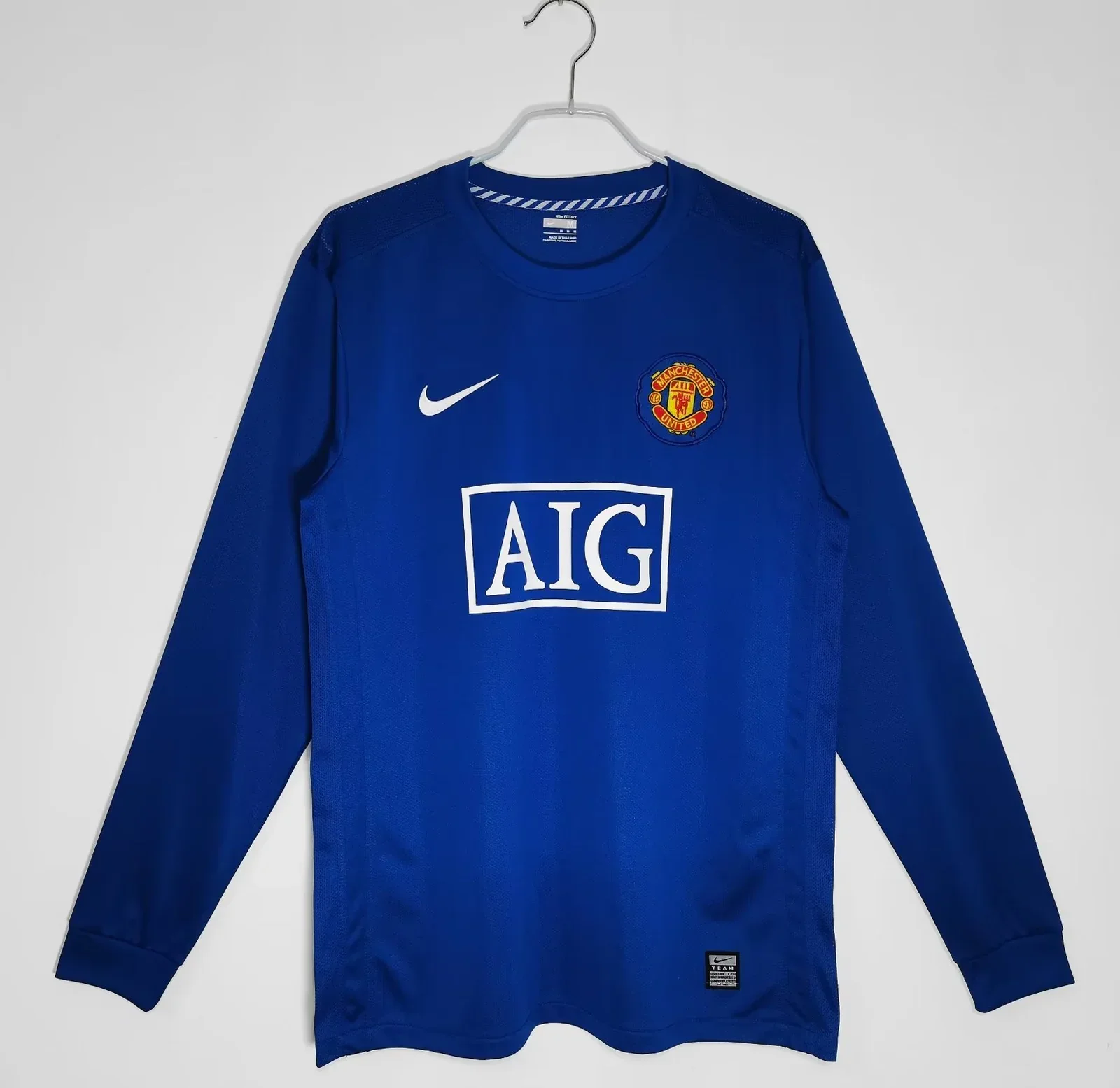 Blue long-sleeve shirt shown on the listing named Manchester United 2008-2009 Away