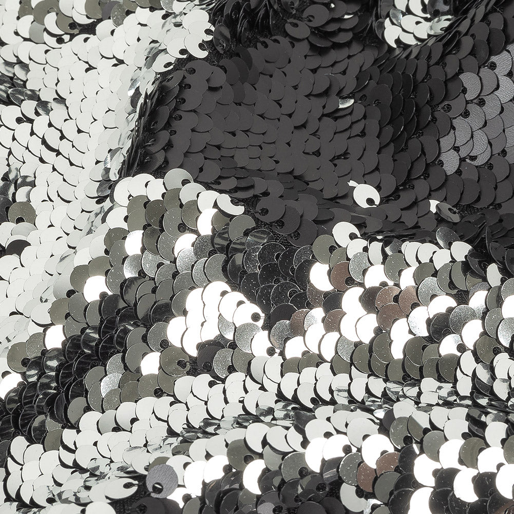 Matte Black and Reflective Silver Two-Tone Reversible Sequins on Black Polyester Jersey - Joann Fabrics