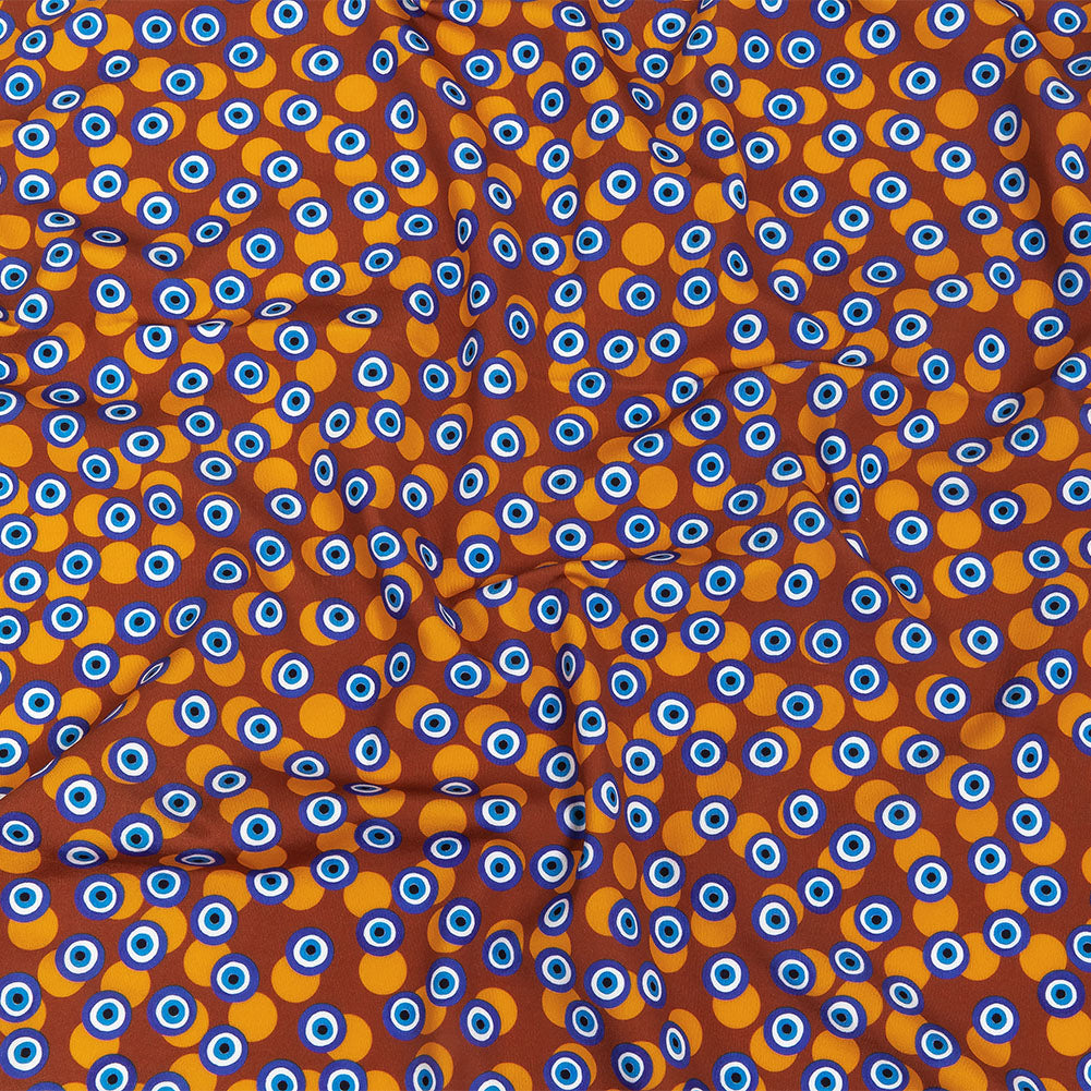 Blue and Brown Bouncing Evil Eye Caye UV Protective Compression Swimwear Tricot with Aloe Vera Microcapsules - Joann Fabrics