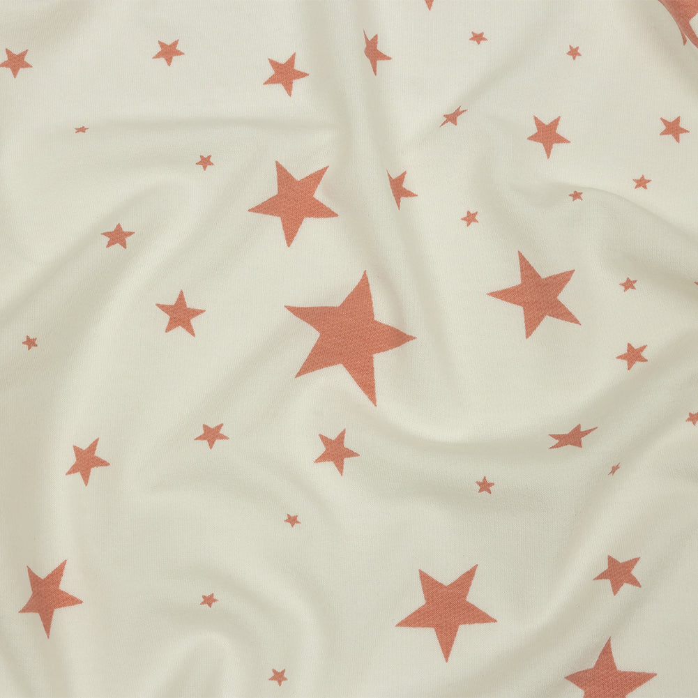 Cloud Dancer and Coral Almond Stars Stretch Polyester and Rayon French Terry - Joann Fabrics