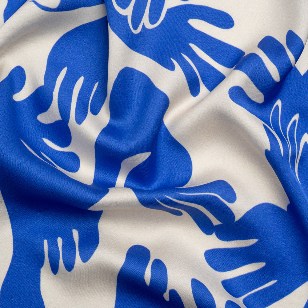 Sustainable and Recycled Viscose Satin Print - Blue and White Hands - Mood Exclusive Helping Hands - Joann Fabrics