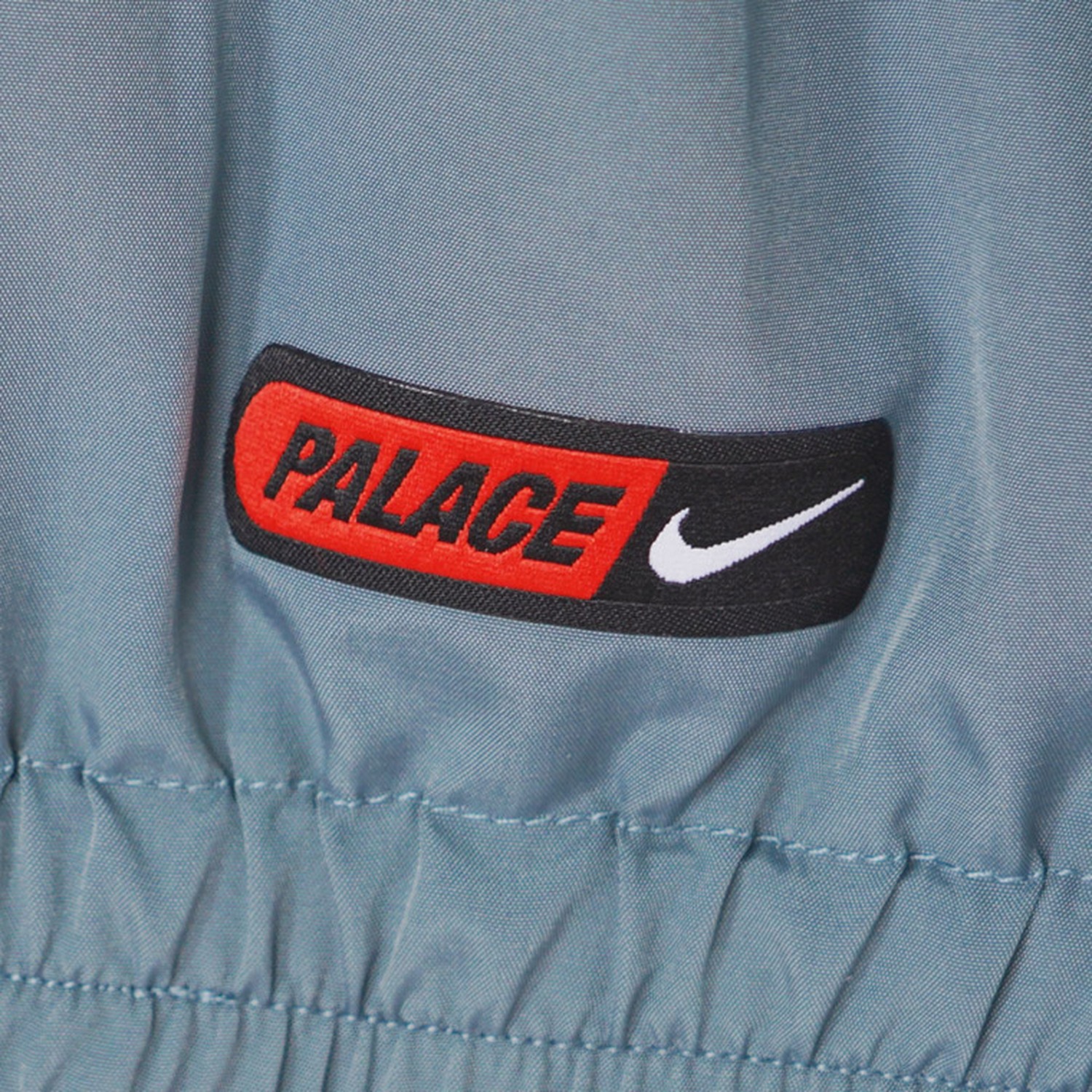 England 2026 x Palace Solo Swoosh Travel Windbreaker Jacket - UnitedFutballJersey