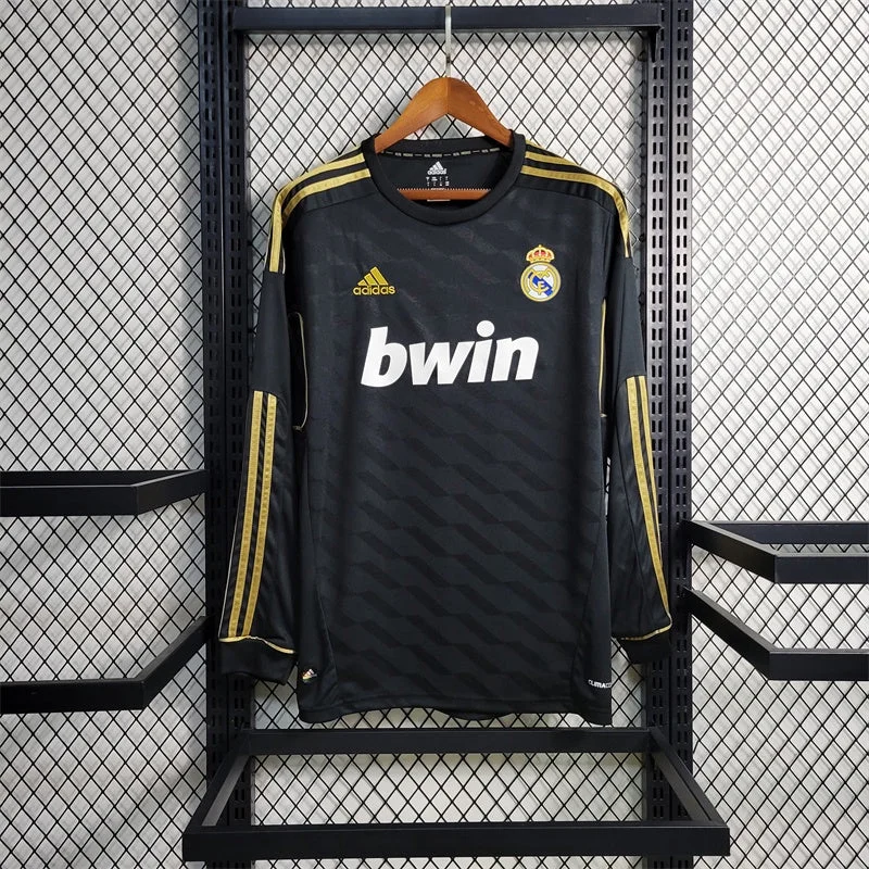 Shop-listed dark-and-gold Real Madrid away long sleeve with bwin lettering and a tonal diagonal pattern