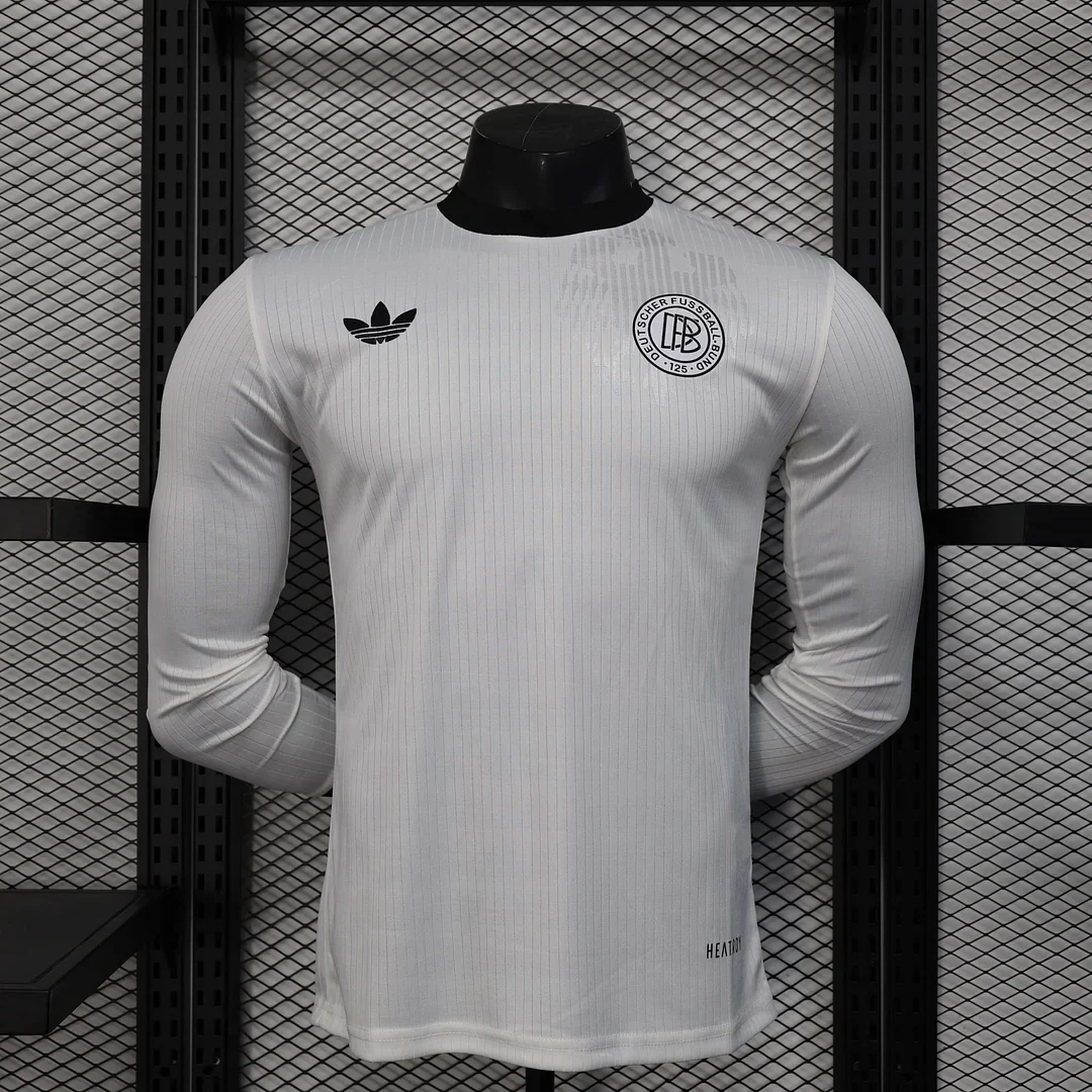 White 2025 Germany anniversary long-sleeve listing with pale vertical stripes and dark chest emblems