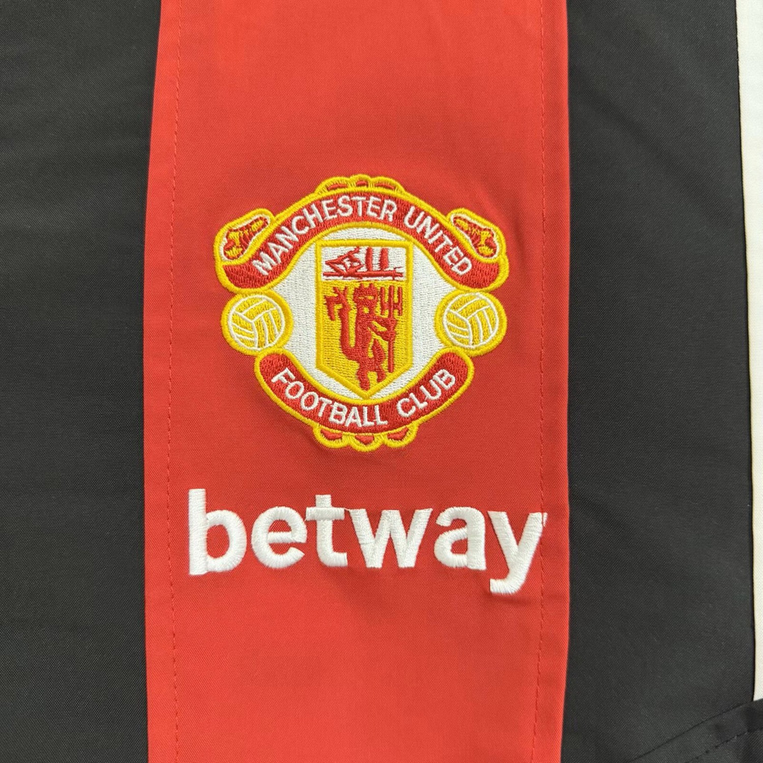 Manchester United 26-27 EQT Black Red Windbreaker Jacket - UnitedFutballJersey