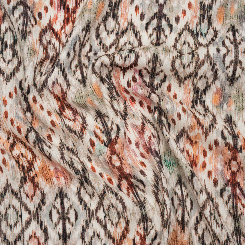 Slubbed Gauzy Cotton Woven - Red, Orange and Dark Green Geometric Ikat - Mood Exclusive Secret Symbols Print - Joann Fabrics