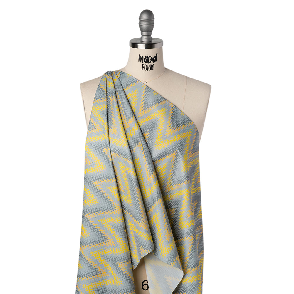 Reflective Print Fabric - Yellow and Gray Ikat Zig Zag with Silver Gray Grid - Joann Fabrics