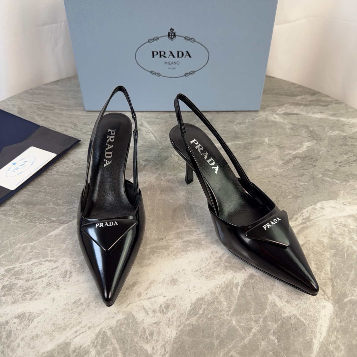 Prada women's black patent leather triangle logo high heels