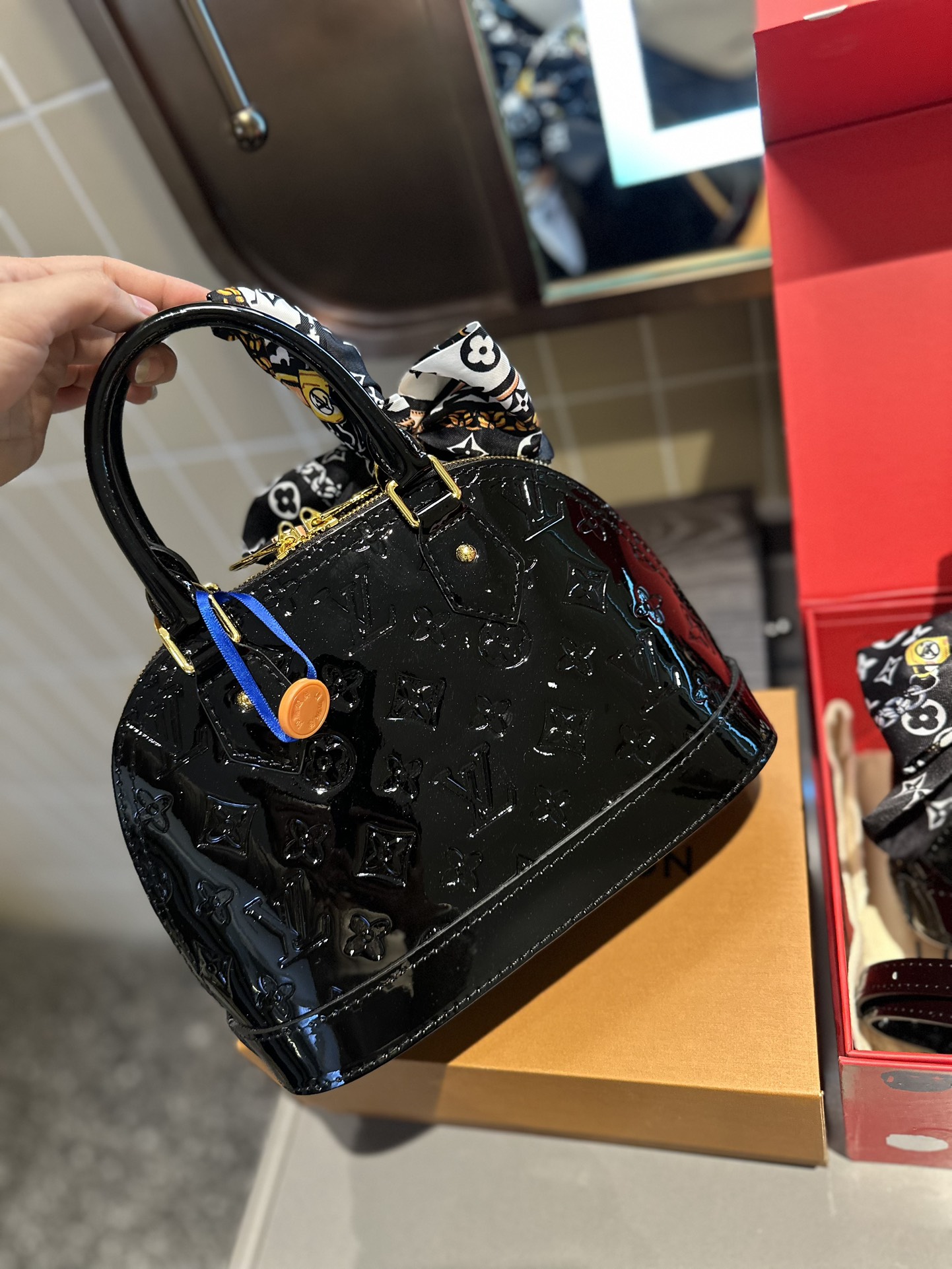 LV Alma Leather Shell Bag