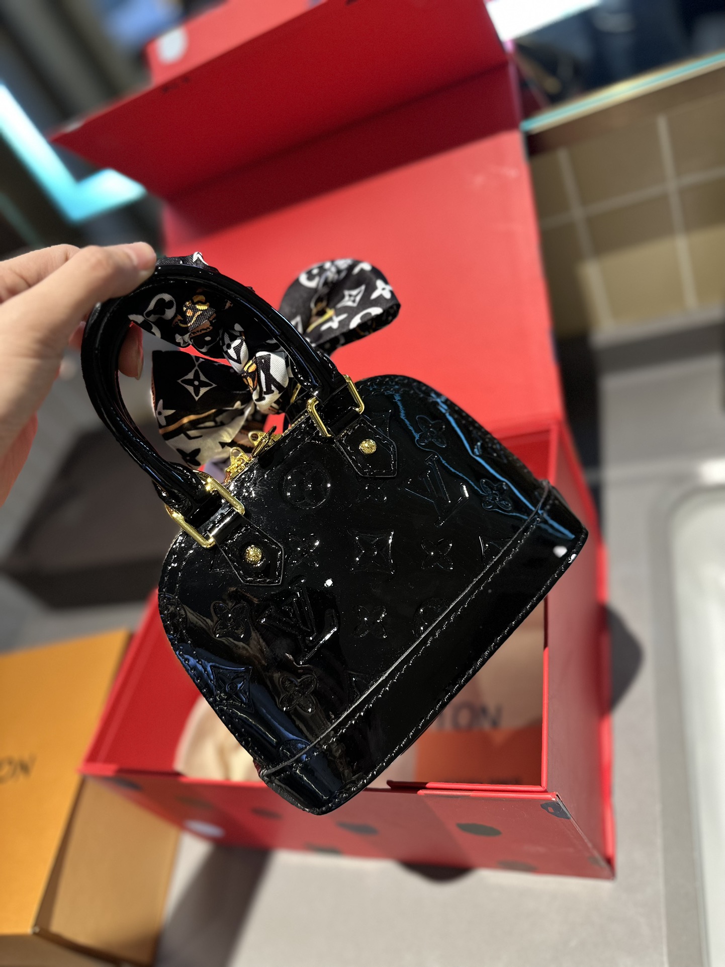 LV Alma Leather Shell Bag