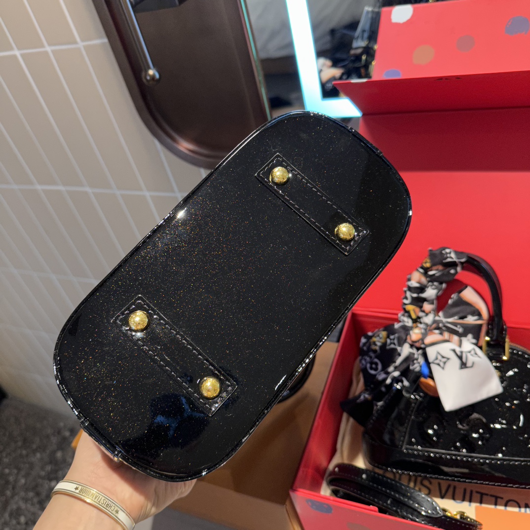 LV Alma Leather Shell Bag