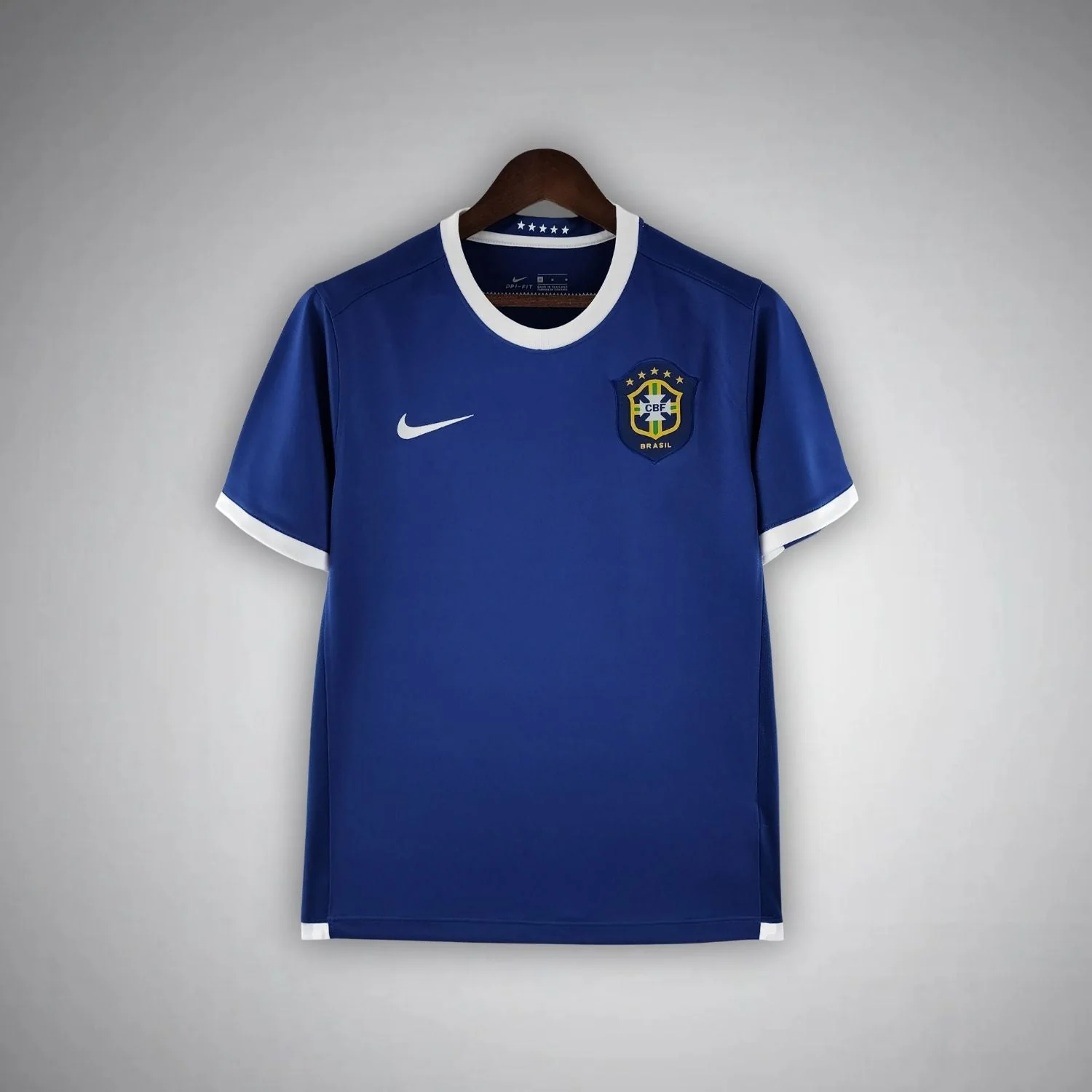 2006 Brazil away shirt with blue body, white round collar and sleeve edging, and separated chest marks