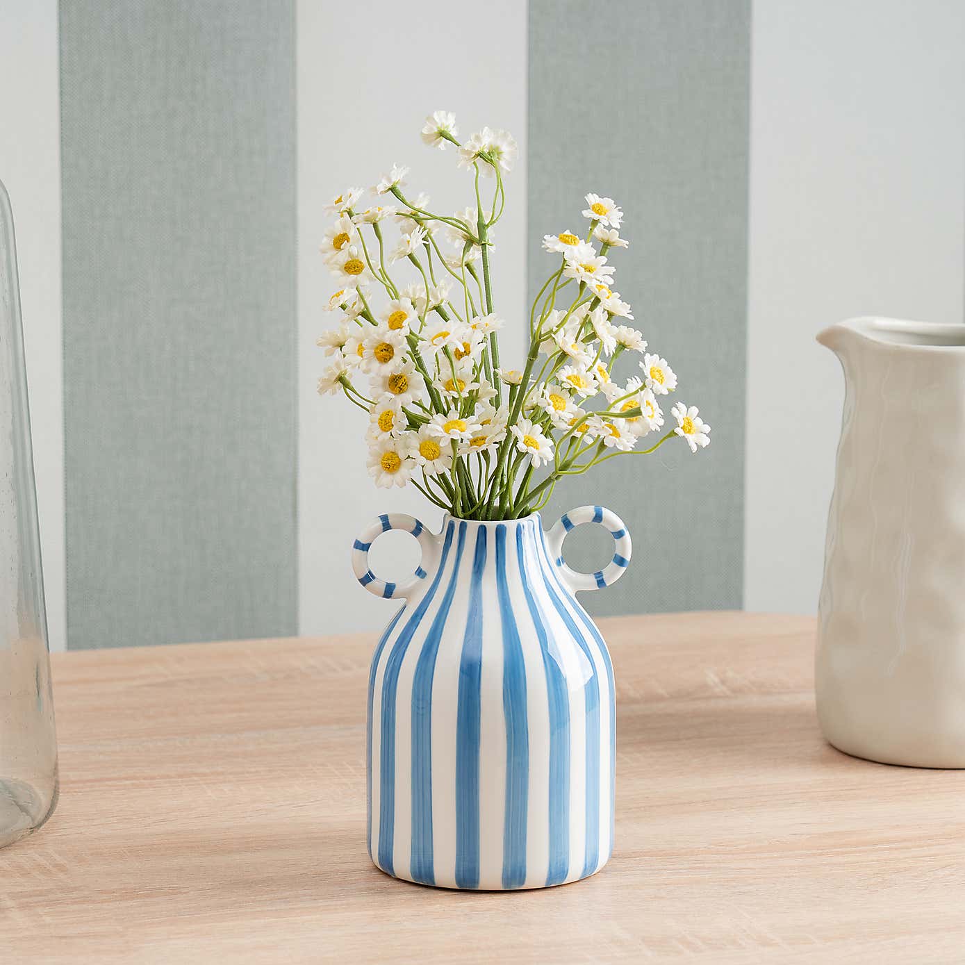 Artificial Daisies in a Ceramic Vase