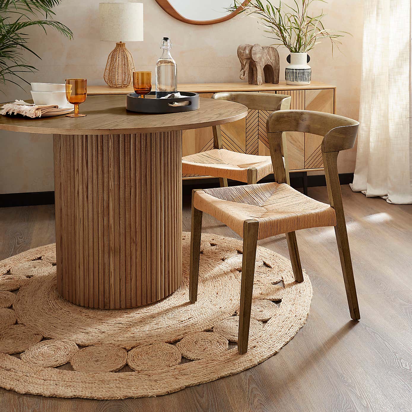 Amari Round Dining Table with Melia Dark Stained Dining Chairs