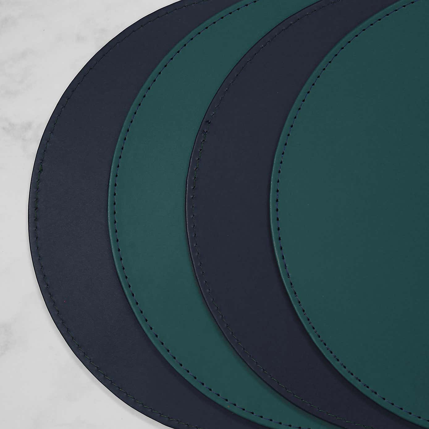 Set of 4 Peacock & Navy Faux Leather Reversible Round Placemats