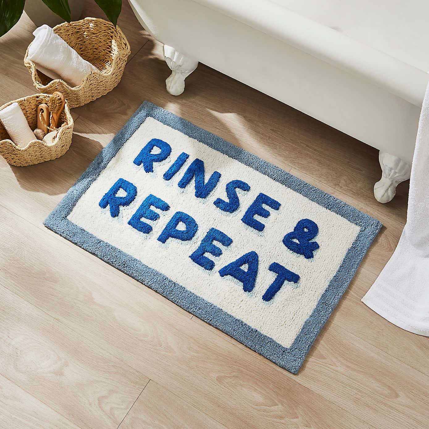 Rinse & Repeat Slogan Bath Mat