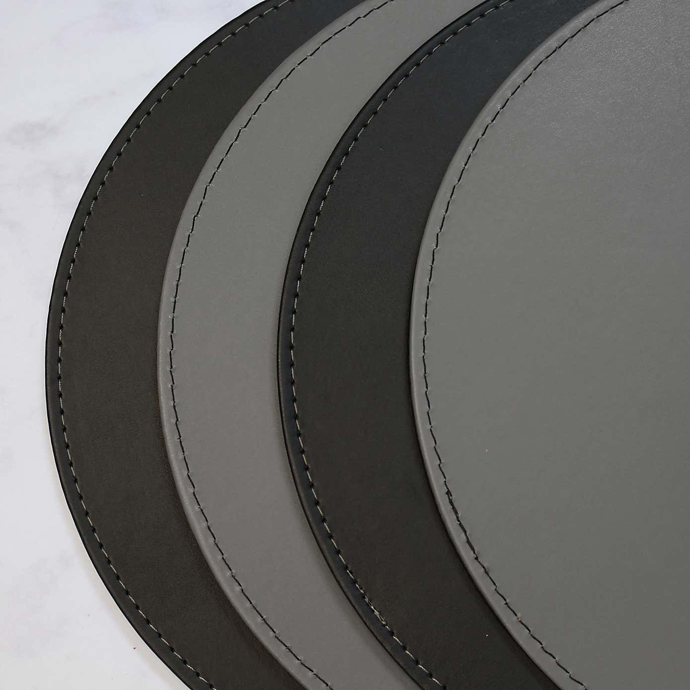 Set of 4 Black & Grey Faux Leather Reversible Round Placemats