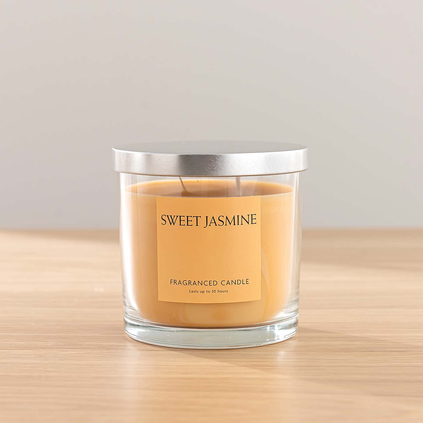 Pink Ranunculus Floral Arrangement in Ribbed Glass Vase with Sweet Jasmine Candle