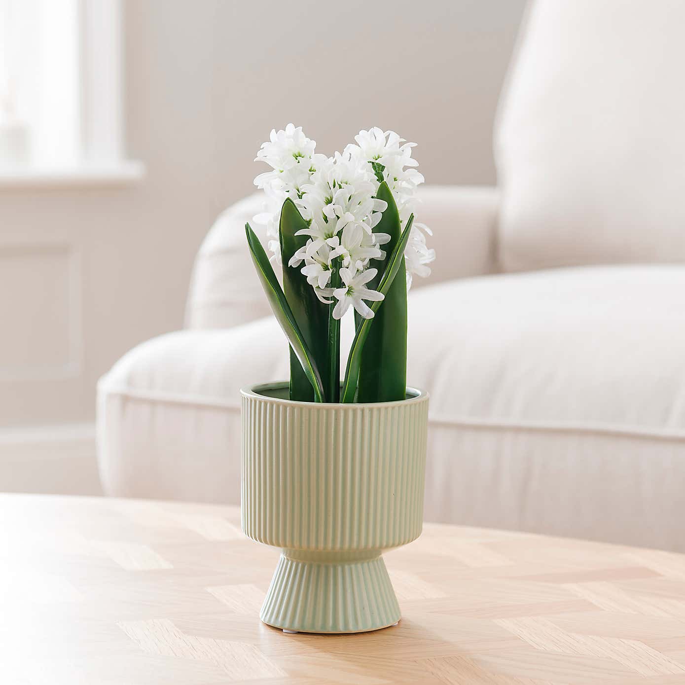 Artificial White Hyacinth in Ribbed Green Ceramic Plant Pot