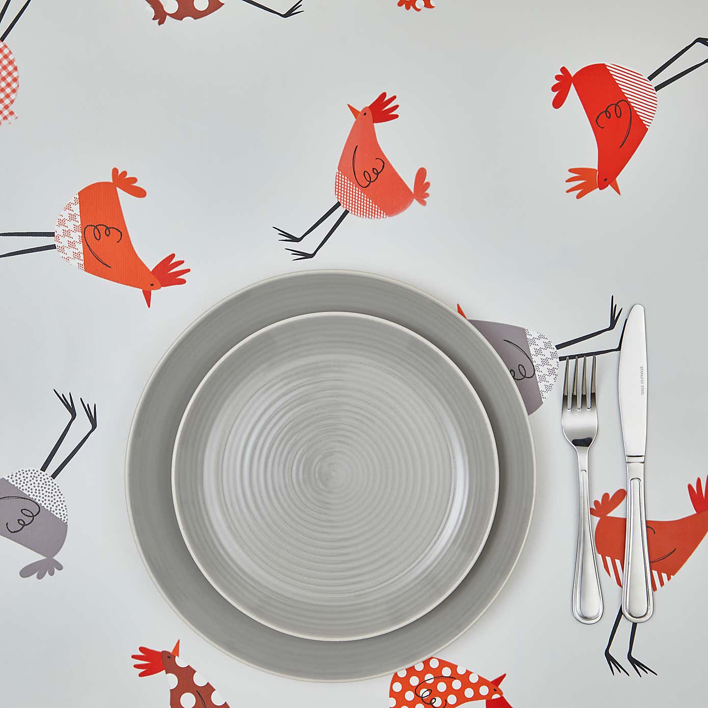 By the Metre Chicken Terracotta PVC