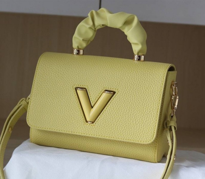 Louis Vuitton Taurillon Leather Twist MM Scrunchie Handle In Ginger Yellow