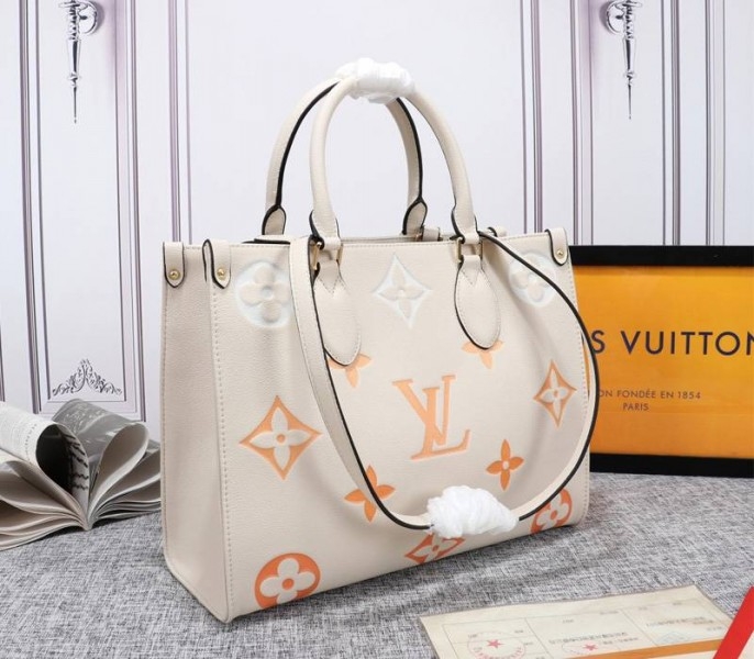 Louis Vuitton Monogram Empreinte Leather Onthego MM Bag In Cream Saffron