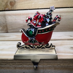 Festive Present Filled Sleigh Christmas Stocking Hanger - Red and Green by Samuel Alexander