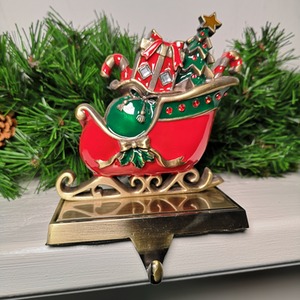 Festive Present Filled Sleigh Christmas Stocking Hanger - Red and Green by Samuel Alexander