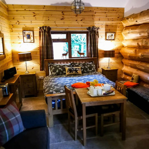 Two Night Stay in a Log Cabin at Badgers Wood, Hoo Zoo and Dinosaur World - Red by Find Me A Gift