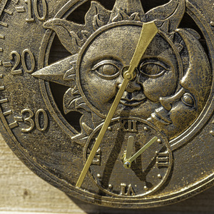 Sun and Moon Bronze Effect Wall Clock - Bronze Effect by Garden Mile
