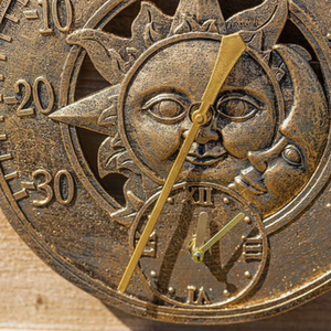 Sun and Moon Bronze Effect Wall Clock - Bronze Effect by Garden Mile