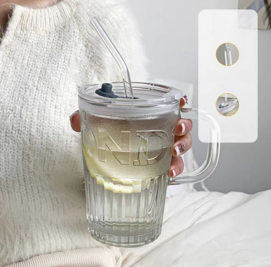 Glass cup with lid and straw