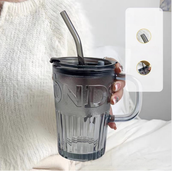 Glass cup with lid and straw