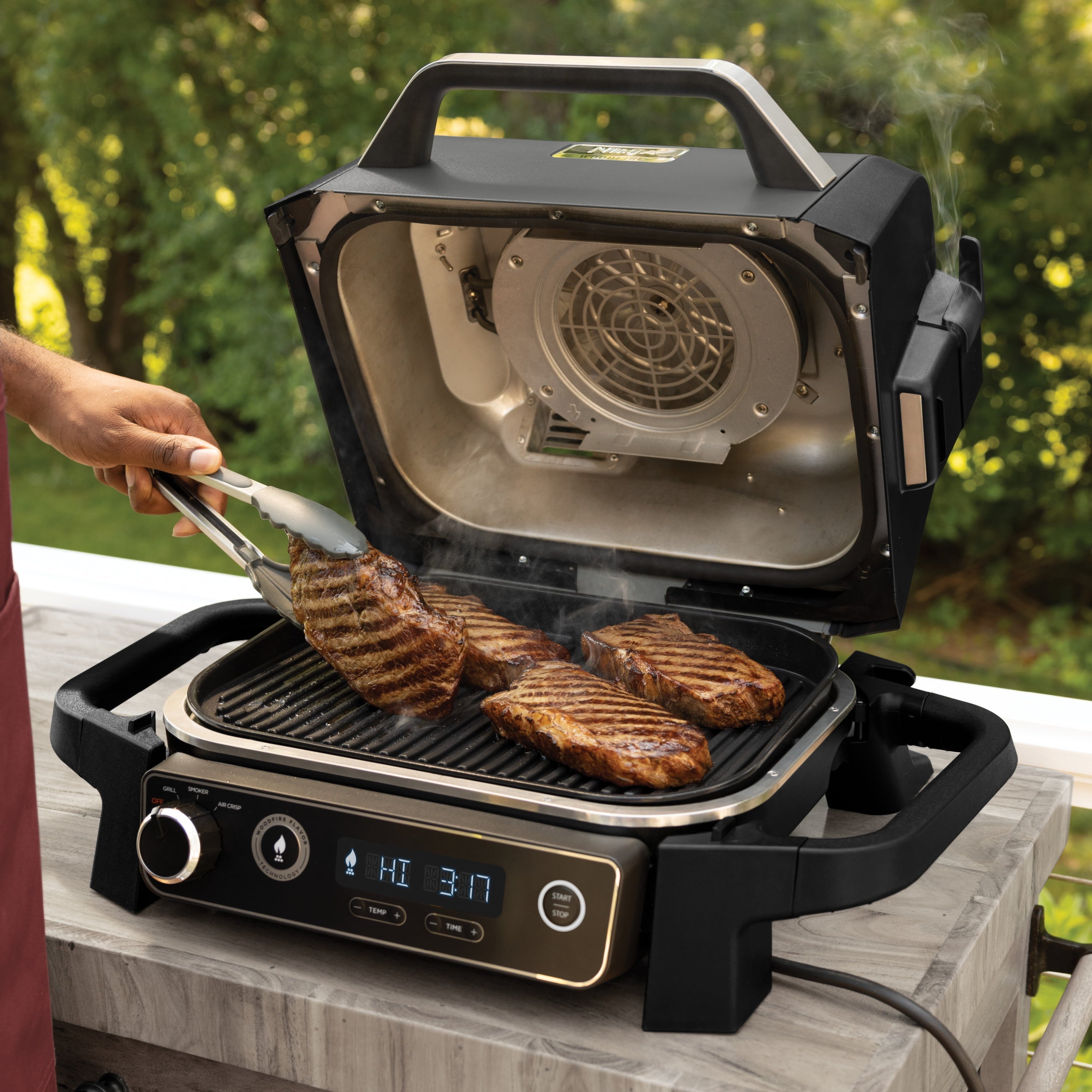Woodfire Outdoor Grill & Smoker. 3-in-1 Master Grill. BBQ Smoker. & Outdoor Air Fryer with Woodfire Technology. OG700