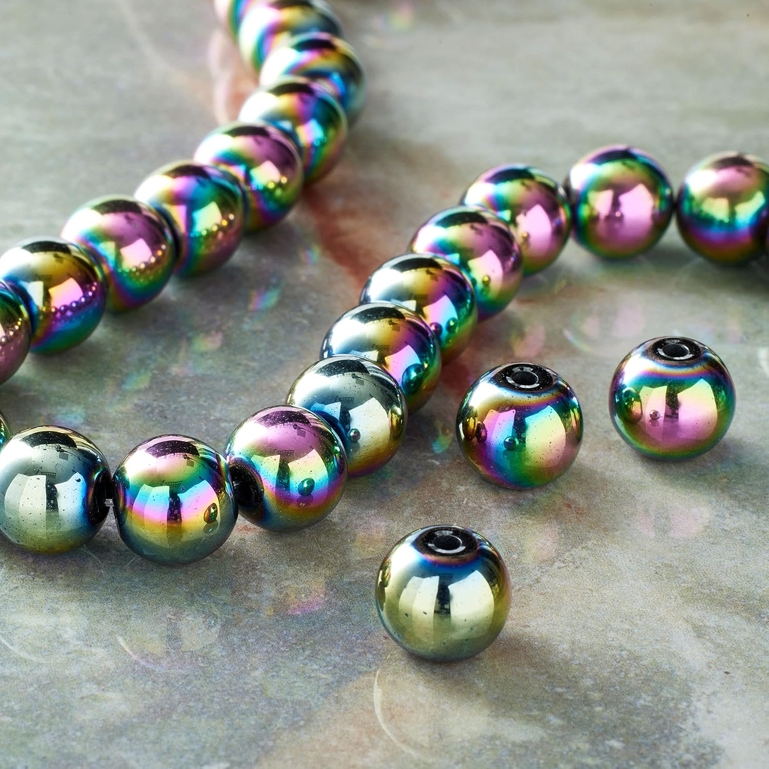 Bead Landing Rainbow Reconstituted Hematite Round Beads, 12 Pack