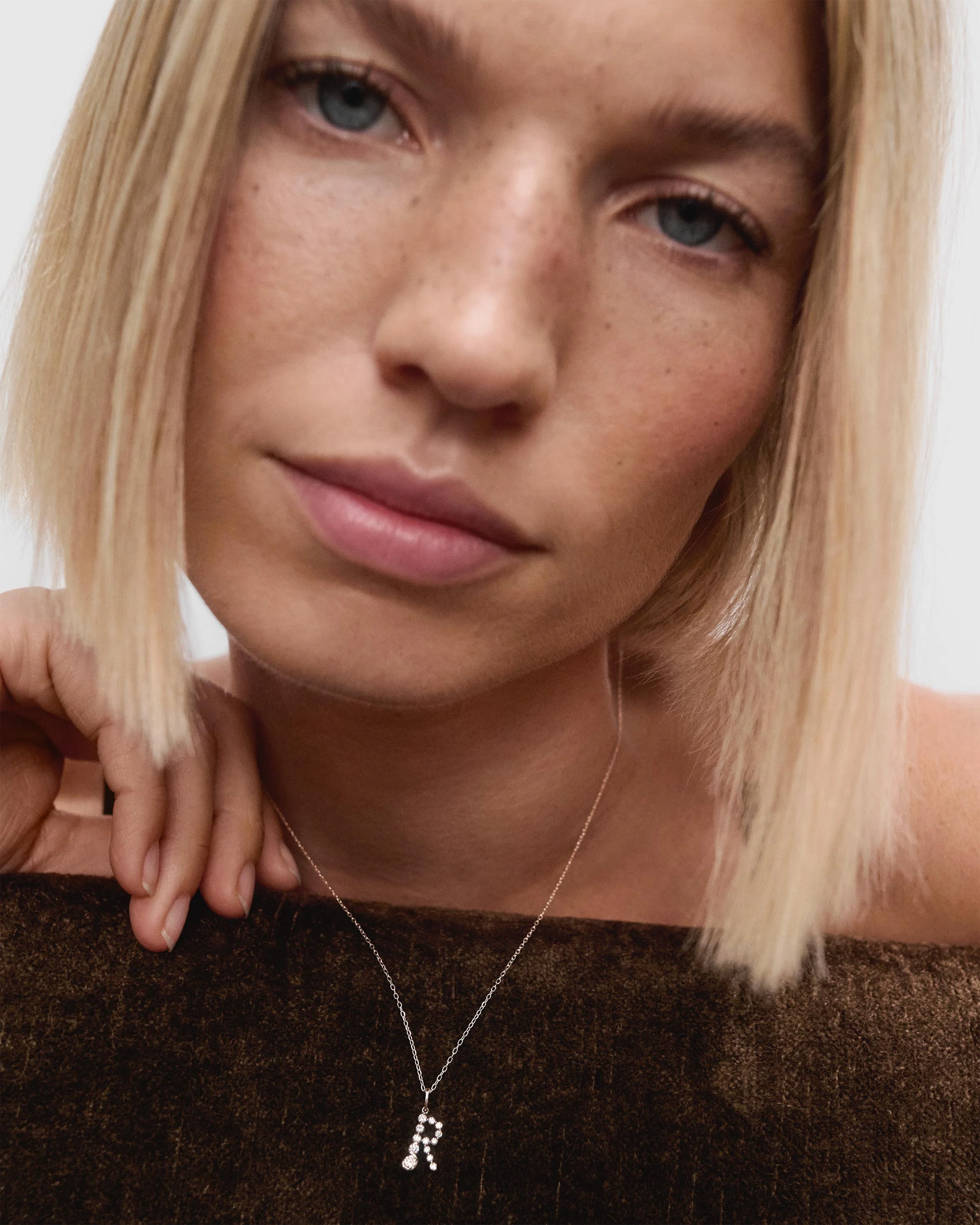 Diamonds and white gold R initial pendant