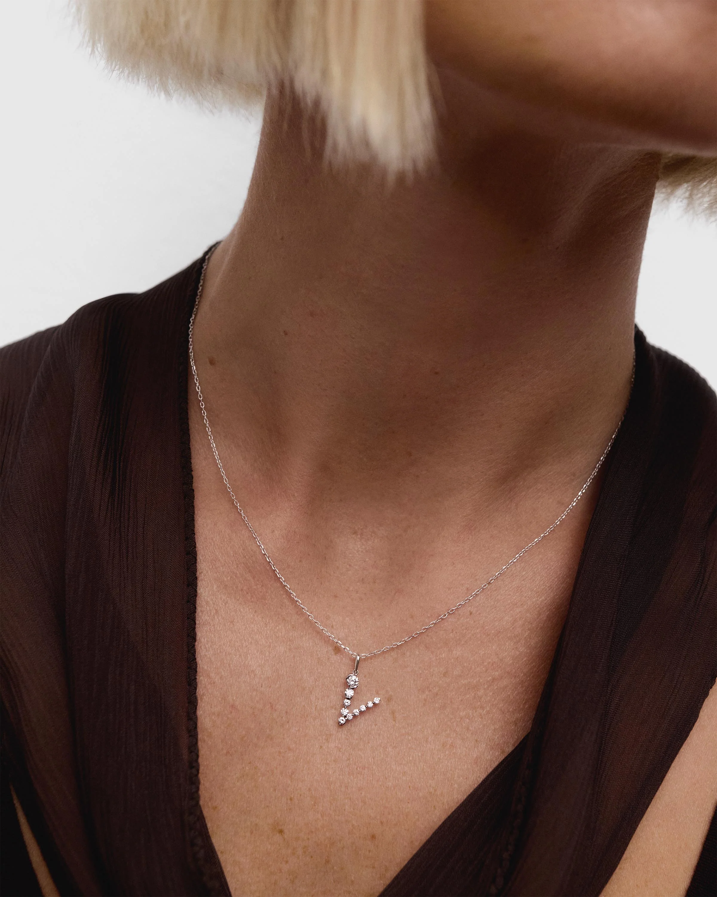 Diamonds and white gold V initial pendant