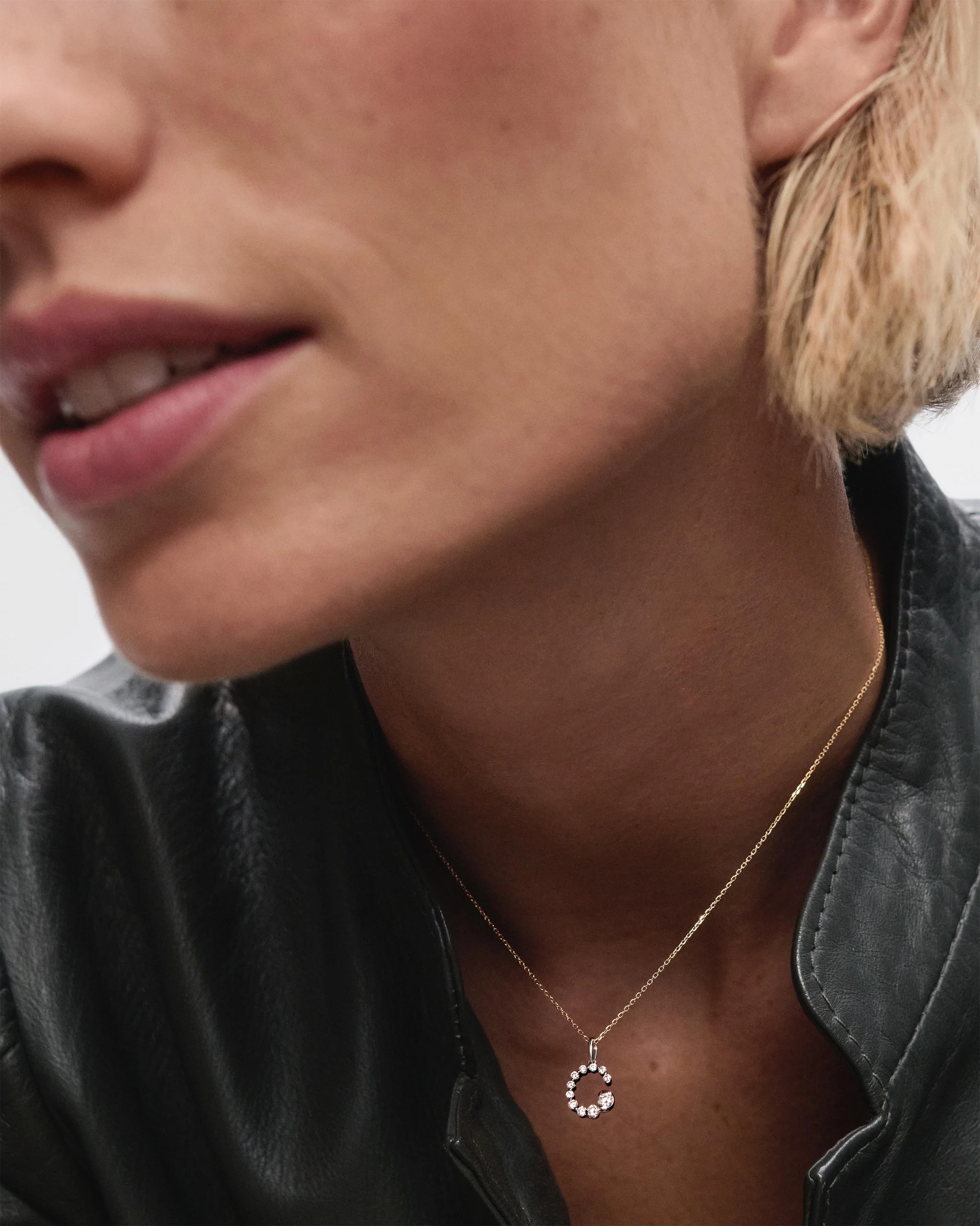 Diamonds and white gold C initial pendant