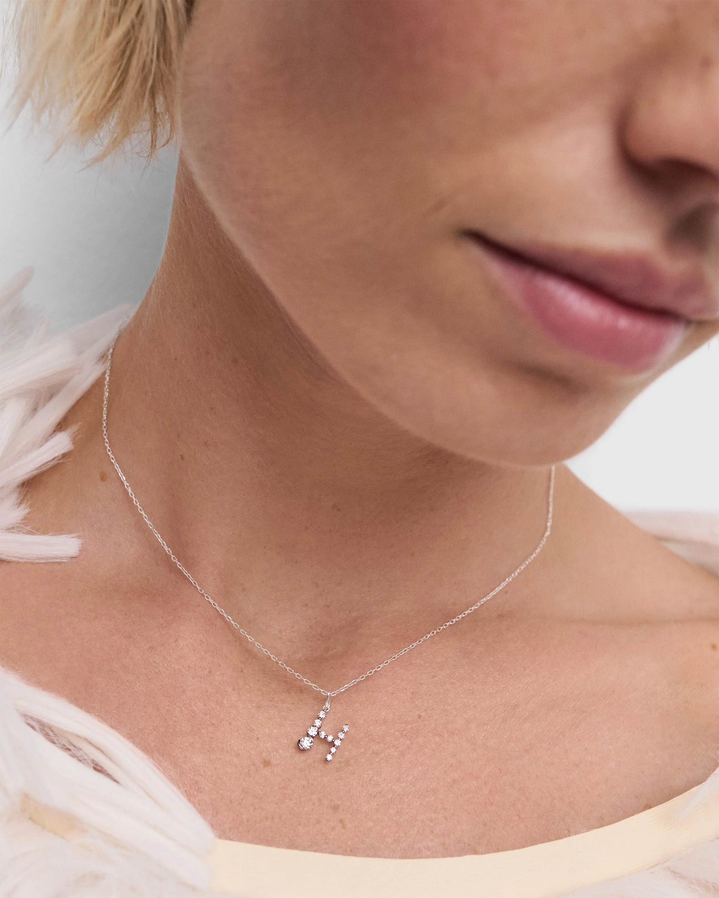 Diamonds and white gold H initial pendant